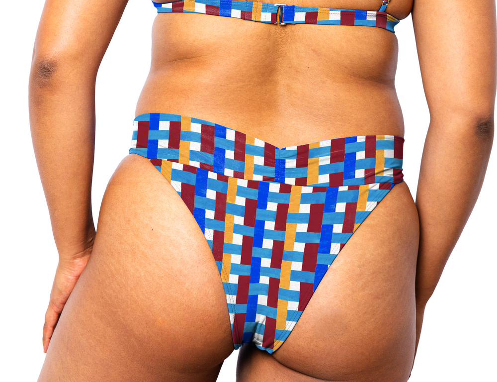 Model facing back wearing Ally Bikini Bottom in Azulejo