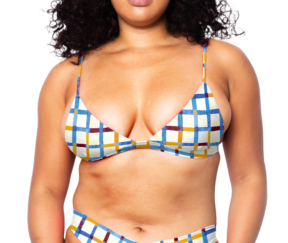 Model facing front wearing Ally Bikini Top in Checker Ecru