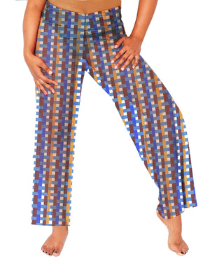 Model with leg to the side wearing the MIGA Marije High Waisted Pants in Azulejo.