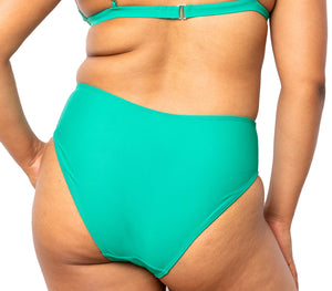 Model looking back wearing Colette Bottom in Emerald Green with matching Ally Bikini top.