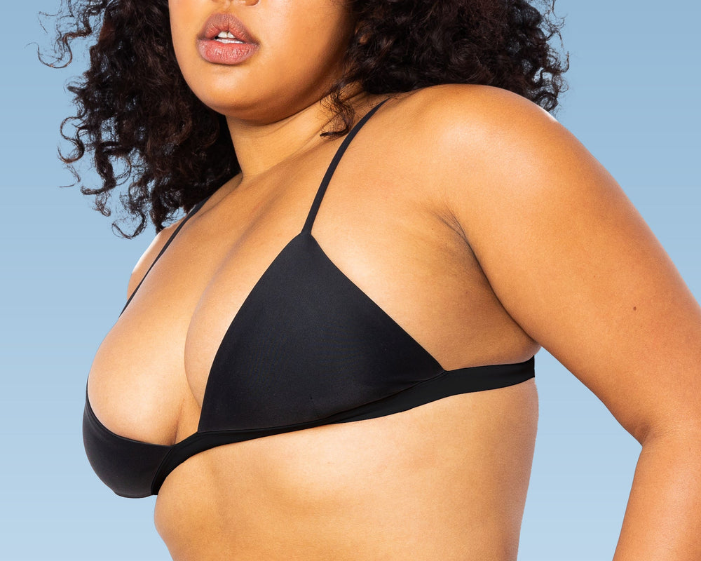 Model wearing MIGA Ally Bikini Top in Black with Adjustable Straps with matching Ally Crossover Bikini Bottom in Black.