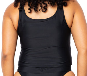 Model looking back wearing black and white tankini top with scoop neck that comes with a front pocket. She is also wearing matching Ally Bikini Bottom in Black.