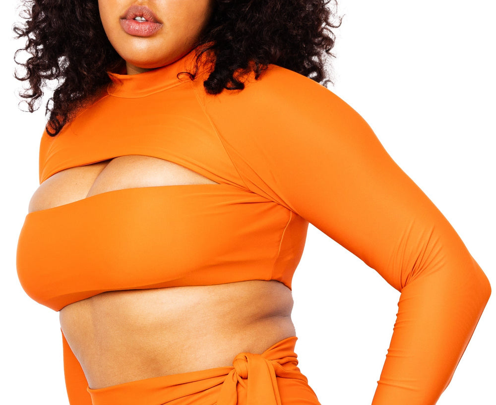 Model wearing Lydia burnt orange long sleeves top with Lydia high-waisted bikini bottom with snap belt.