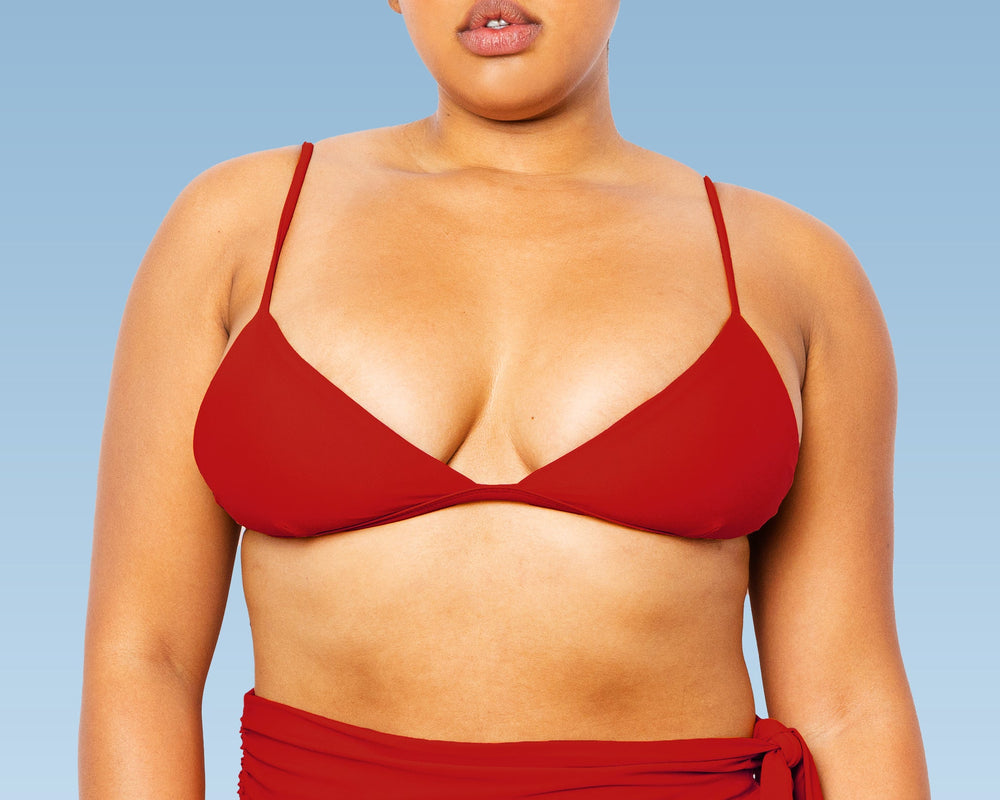 Model wearing MIGA Ally Bikini Top in Red with Adjustable Straps with matching Lydia Maternity Snap Belt Bikini Bottom in Red.