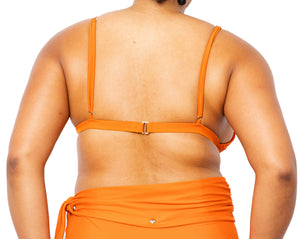 
            
                Load image into Gallery viewer, Model facing back wearing MIGA Ally Bikini Top in Burnt Orange with Adjustable Straps and Lydia Bikini Bottom.
            
        