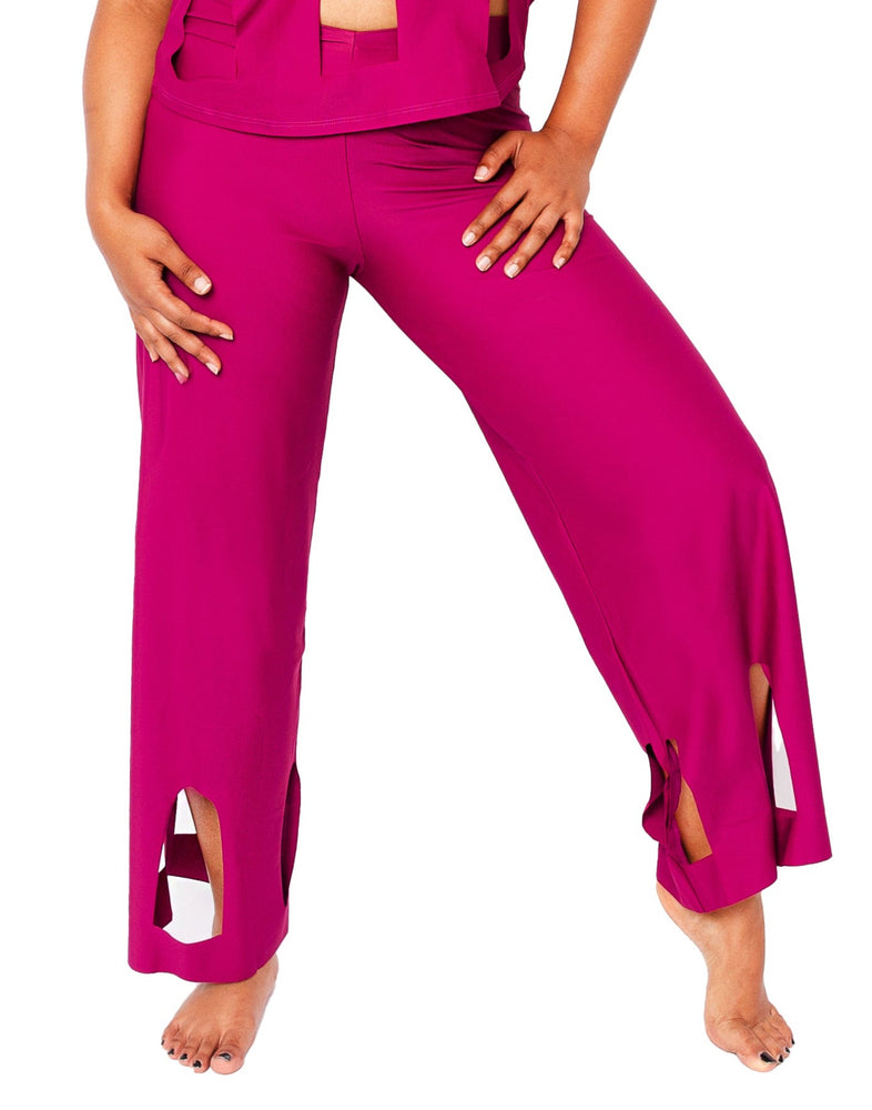 
            
                Load image into Gallery viewer, Model wearing Marije pants and matching top in magenta. 
            
        